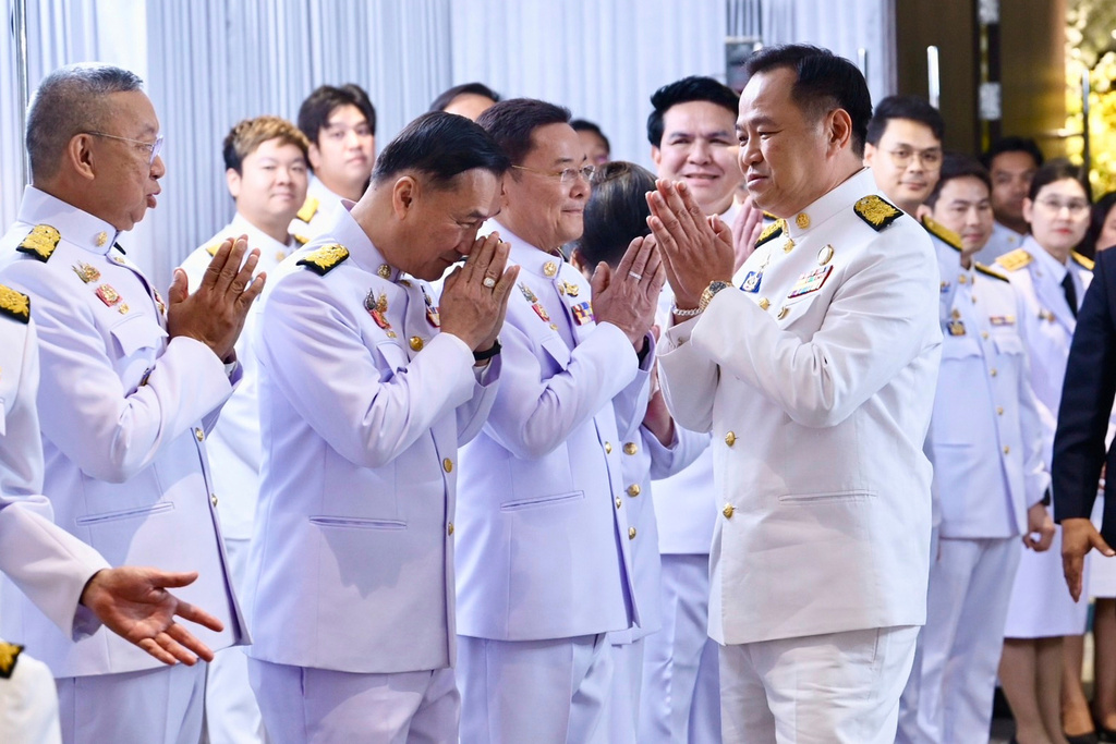 In this photo released by the Thai government spokesman office. Thailand's new Prime Minister Anutin Charnvirakul, right, talks to Bhumjai Thai lawmakers at Bhumjai Thai party Headquarters after receiving a royal endorsement in Bangkok, Thailand, Sunday, Sept. 7, 2025. (Thai government spokesman office via AP)