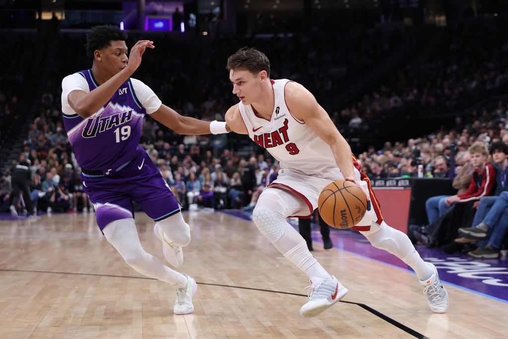 Miami Heat guard Pelle Larsson (9) drives to the basket against Utah Jazz guard Ace Bailey (19) during the first half of an NBA basketball game, Saturday, Jan. 24, 2026, in Salt Lake City. (AP Photo/Rob Gray)