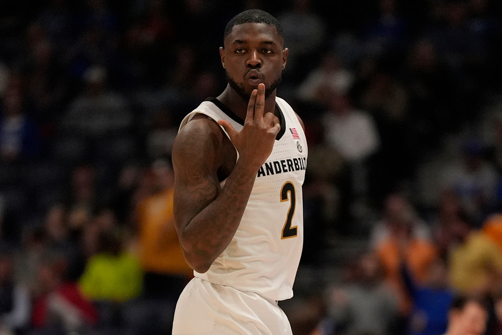 Vanderbilt guard Duke Miles (2) celebrates his three-point basket against Tennessee during the second half of an NCAA college basketball game in the quarterfinal round of the Southeastern Conference tournament, Friday, March 13, 2026, in Nashville, Tenn. (AP Photo/George Walker IV)