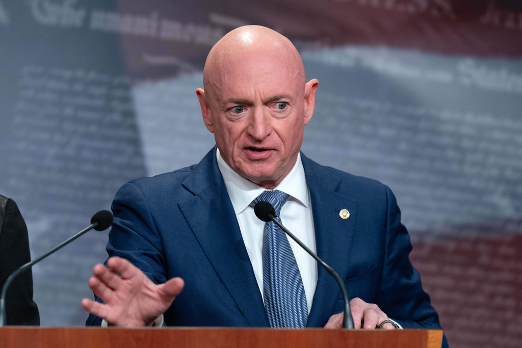Sen. Mark Kelly, D-Ariz., speaks during a news conference at Capitol Hill, Wednesday, Feb. 11, 2026, in Washington. (AP Photo/Jose Luis Magana)