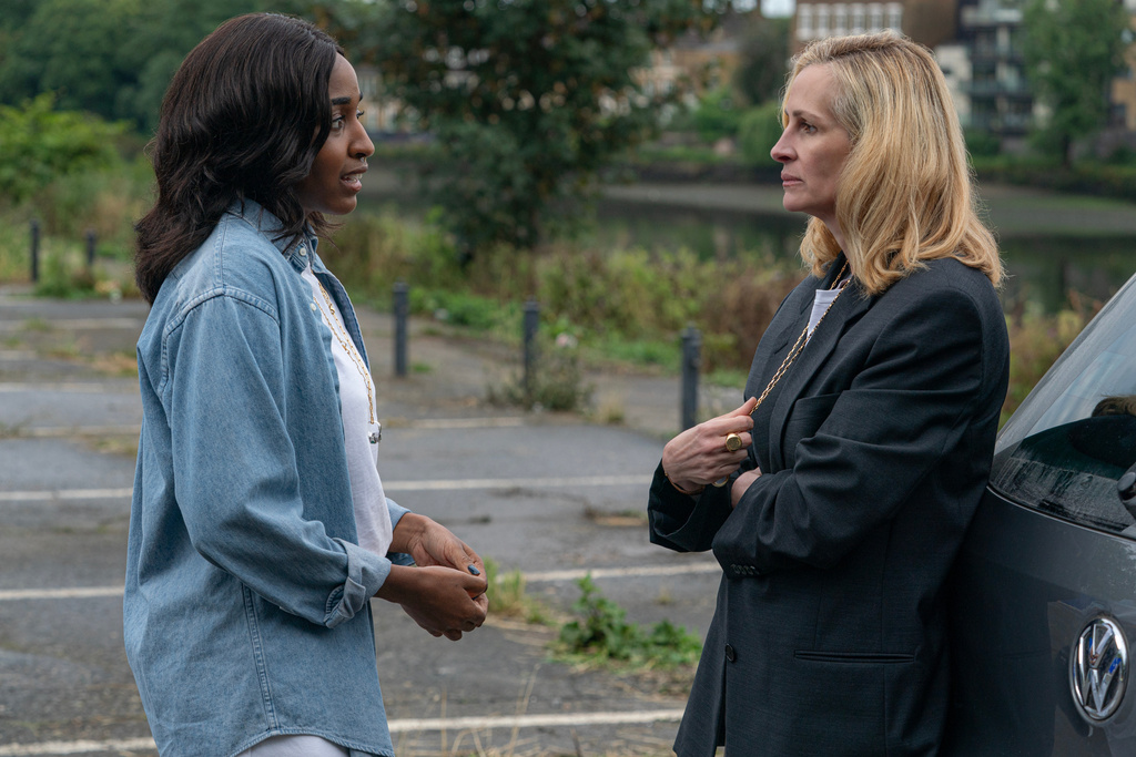 This image released by Amazon MGM Studios shows Ayo Edebiri, left, and Julia Roberts in a scene from "After the Hunt." (Yannis Drakoulidis/Amazon MGM Studios via AP)