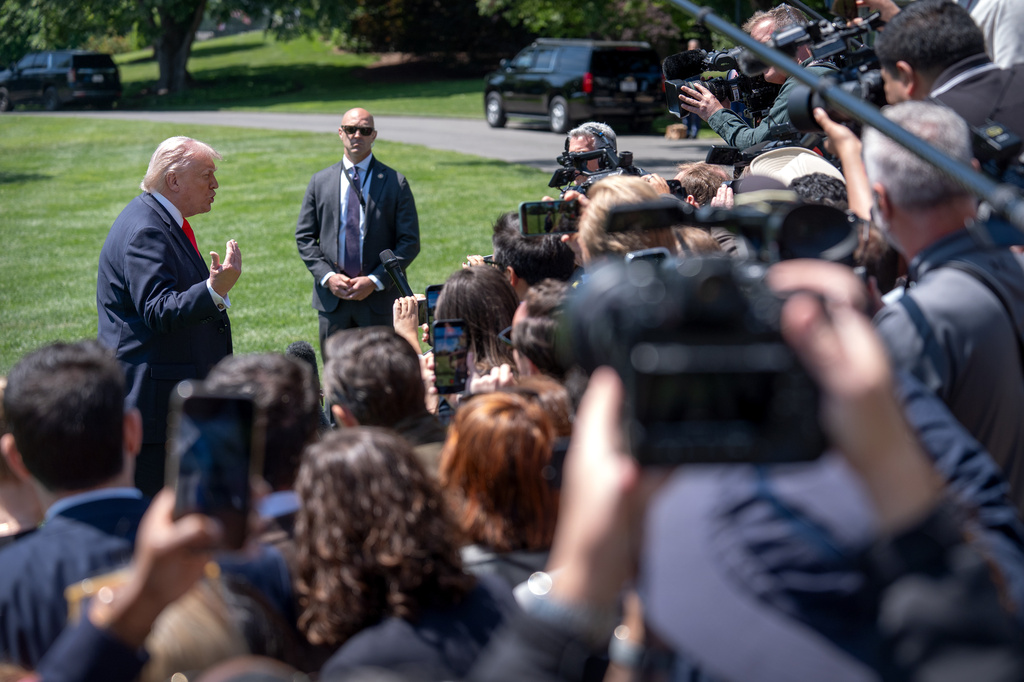 President Donald Trump speaks with reporters as he prepares to board Marine One on the South Lawn of the White House, Friday, May 1, 2026, in Washington. (AP Photo/Mark Schiefelbein)