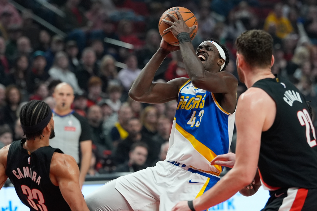 Indiana Pacers forward Pascal Siakam (43) shoots as Portland Trail Blazers forward Toumani Camara (33) falls to the floor during the first half of an NBA basketball game Sunday, March 8, 2026, in Portland, Ore. (AP Photo/Jenny Kane)