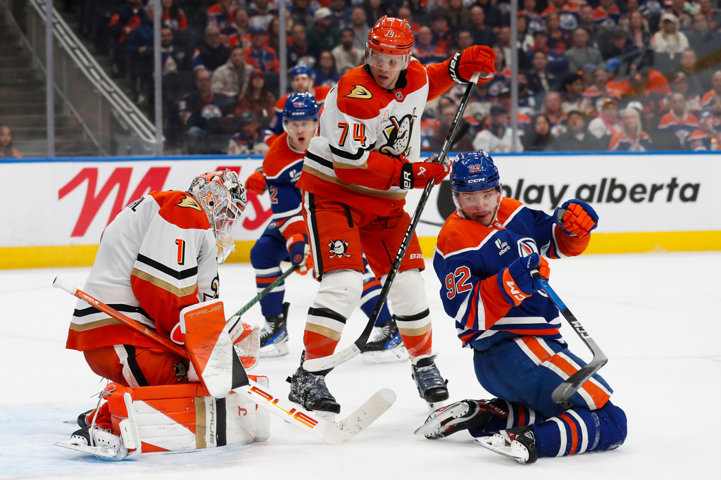 Anaheim Ducks goaltender Lukas Dostal (1) makes a save against Edmonton Oilers' Vasily Podkolzin (92) during second period NHL playoff action in Edmonton on Wednesday, April 22, 2026. (Codie McLachlan/The Canadian Press via AP)