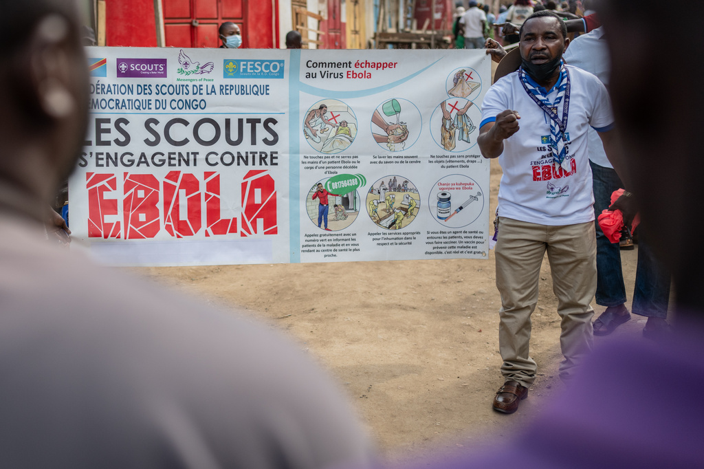 Francois Kasereka, a member of the Congo Scouts movement, speaks to people during a public sensitisation campaign amid the Ebola outbreak in Bunia, Congo, Saturday, May 23, 2026. (AP Photo/Moses Sawasawa)