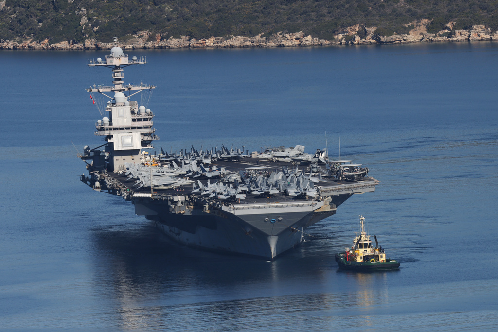The USS Gerald R. Ford, the world's largest aircraft carrier, departs from Souda Naval Base near Chania on the island of Crete, Greece, Thursday, Feb. 26, 2026. (AP Photo/Giannis Angelakis)