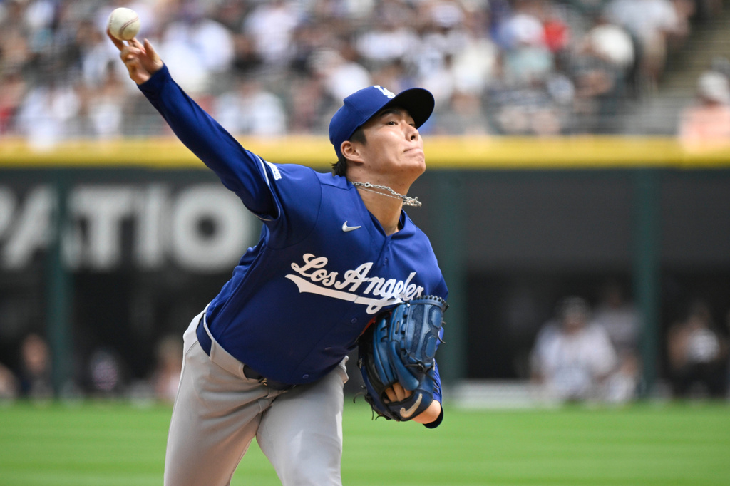 Los Angeles Dodgers pitcher Yoshinobu Yamamoto, of Japan, delivers during the first inning of a baseball game against the Chicago White Sox, Saturday, June 13, 2026, in Chicago. (AP Photo/Matt Marton)