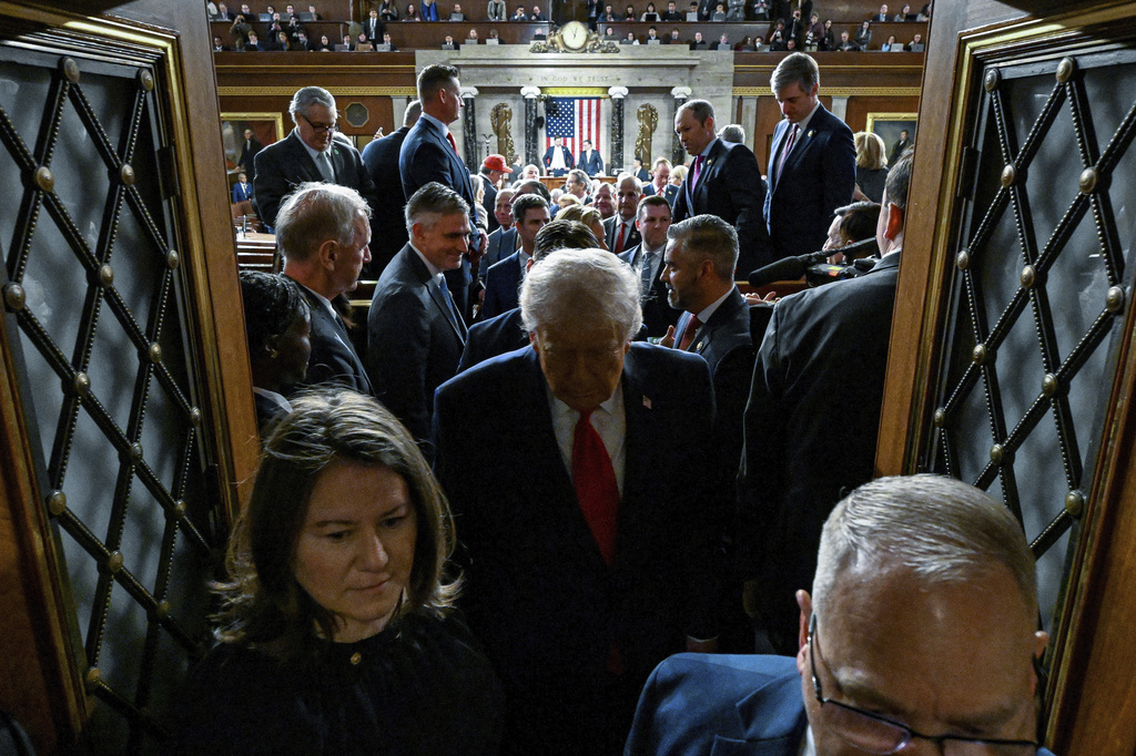 President Donald Trump exits the House Chamber after delivering the State of the Union address to a joint session of Congress in the House chamber at the U.S. Capitol in Washington, Tuesday, Feb. 24, 2026. (Kenny Holston/The New York Times via AP, Pool)