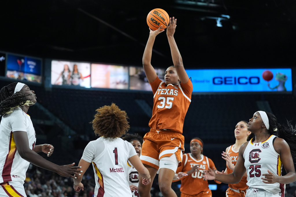Texas forward Madison Booker (35) shoots over South Carolina guard Maddy McDaniel (1) during the second half of an NCAA college basketball game in the Players Era tournament in Las Vegas, Thursday, Nov. 27, 2025. (AP Photo/Eric Gay)