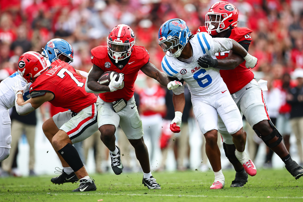 FILE - Georgia running back Nate Frazier (3) runs with the ball during the first half of an NCAA college football game against Mississippi, Saturday, Oct. 18, 2025, in Athens, Ga. (AP Photo/Colin Hubbard, File)