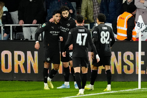 Manchester City's Omar Marmoush, left, celebrates scoring with teammates during the English League Cup fourth round soccer match between Swansea City and Manchester City in Swansea, Wales, Wednesday Oct. 29, 2025. (Nick Potts/PA via AP) Manchester City's Omar Marmoush, left, celebrates scoring with teammates during the English League Cup fourth round soccer match between Swansea City and Manchester City in Swansea, Wales, Wednesday Oct. 29, 2025. (Nick Potts/PA via AP)