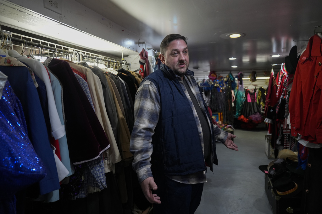 Owner Courtland Hickey talks about how tariffs have increased the cost of new costumes and his hope for selling some of his vintage inventory at Chicago Costume, Wednesday, Sept. 17, 2025, in Chicago. (AP Photo/Erin Hooley)