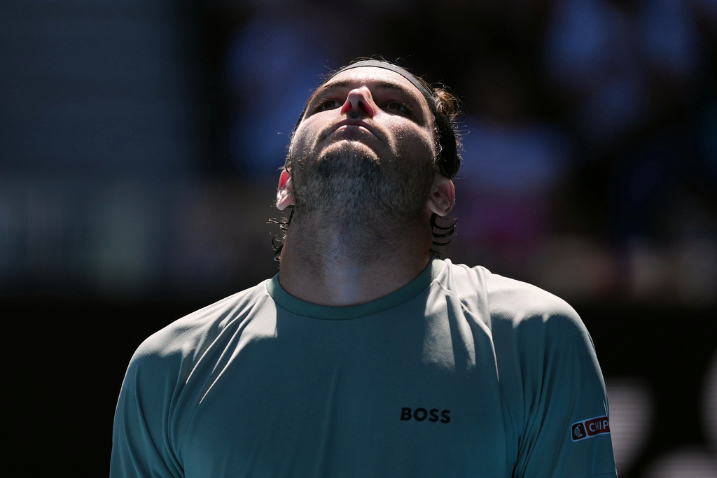Taylor Fritz of the U.S. reacts as he plays against Lorenzo Musetti of Italy during their fourth round match at the Australian Open tennis championship in Melbourne, Australia, Monday, Jan. 26, 2026. (AP Photo/Asanka Brendon Ratnayake)