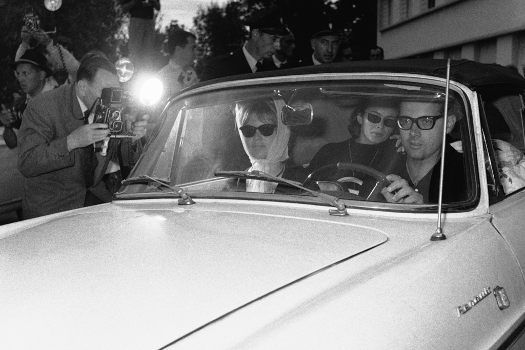 FILE - Brigitte Bardot is driven from the St. Francois neurological clinic, Oct. 3, 1960 by press representative Michel Simon. (AP Photo/File)