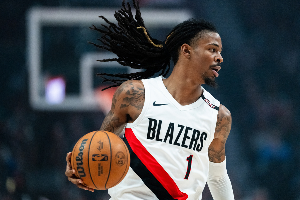 Portland Trail Blazers guard Ja Morant brings the ball up the court during the first half of a preseason NBA basketball game against the Golden State Warriors on Wednesday, Oct. 7, 2026, in Portland, Ore. (AP Photo/Ali Gradischer)