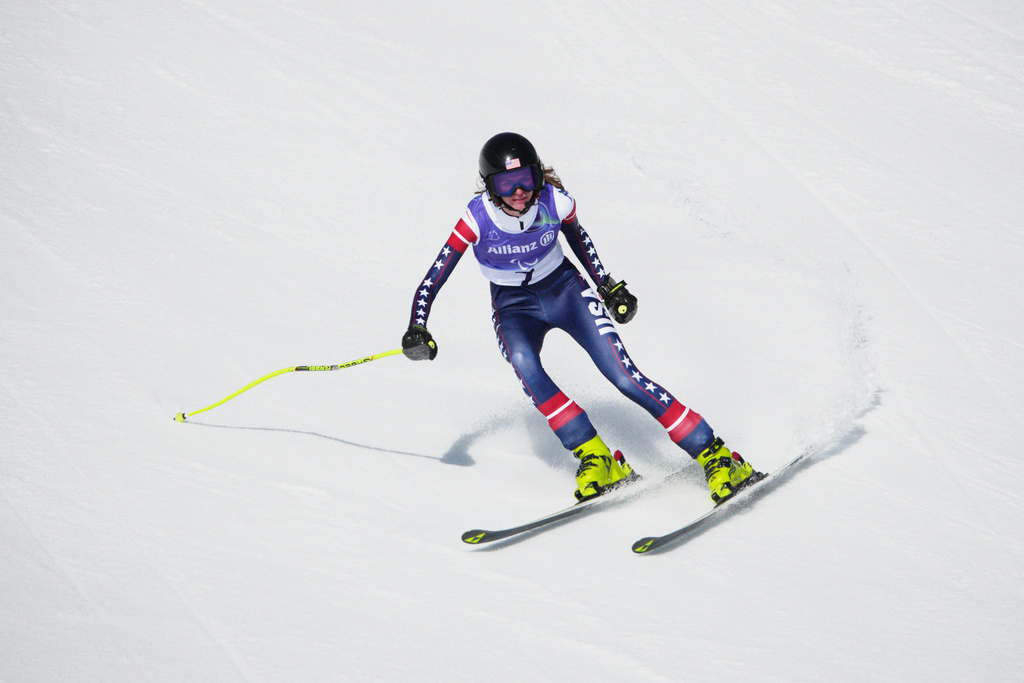 Meg Gustafson, of the United States, skis during the alpine skiing the women's downhill VI competition at the 2026 Winter Paralympics, in Cortina d'Ampezzo, Italy, Saturday, March 7, 2026. (AP Photo/Emilio Morenatti)