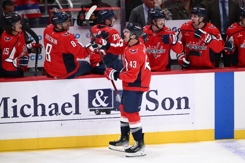Washington Capitals right wing Tom Wilson (43) celebrates his goal during the second period of an NHL hockey game against the New York Islanders, Friday, Oct. 31, 2025, in Washington. (AP Photo/Nick Wass)
