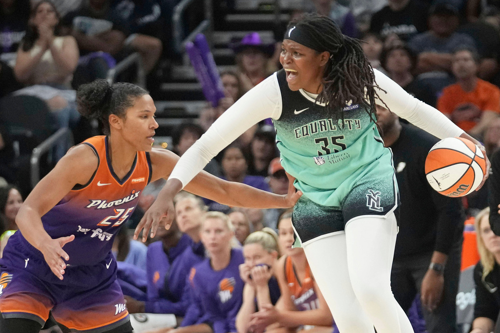 FILE - New York Liberty center Jonquel Jones (35) looks for an outlet against Phoenix Mercury forward Alyssa Thomas (25) during the second half of Game 1 during the first round of the WNBA basketball playoffs Sunday, Sept. 14, 2025, in Phoenix. (AP Photo/Darryl Webb, File)