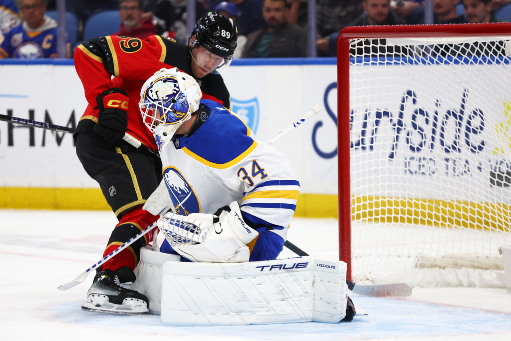 Ottawa Senators center Lars Eller (89) is stopped by Buffalo Sabres goaltender Alex Lyon (34) during the second period of an NHL hockey game Wednesday, Oct. 15, 2025, in Buffalo, N.Y. (AP Photo/Jeffrey T. Barnes)