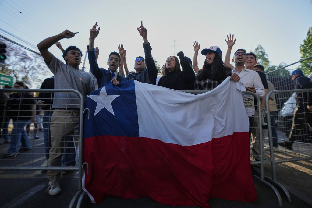 Supporters of presidential candidate Jose Antonio Kast of the Republican Party react after the polls closed in general elections in Santiago, Chile, Sunday, Nov. 16, 2025. (AP Photo/Esteban Felix)