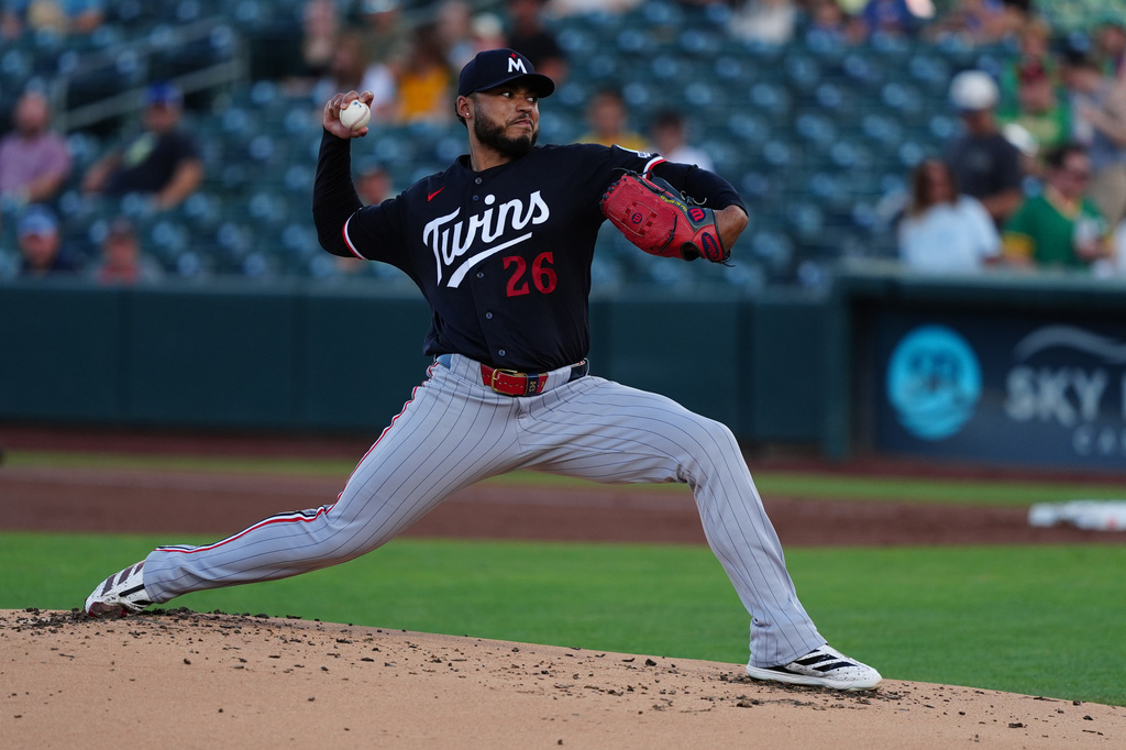 Minnesota Twins pitcher Taj Bradley (26) throws in the first inning of a baseball game against the Athletics Tuesday, Aug. 25, 2026, in West Sacramento, Calif. (AP Photo/Alan Greth)