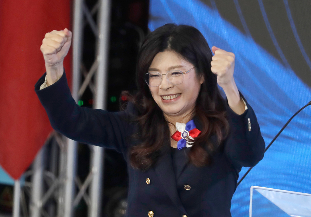 FILE - Cheng Li-wun, newly elected chairperson of Taiwan's main opposition Nationalist Party, or Kuomintang (KMT), cheers during a party congress in Taipei, Taiwan, on Nov. 1, 2025. (AP Photo/Chiang Ying-ying, File)