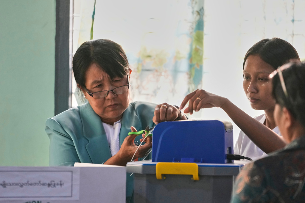 Official of the Union Election Commission prepares to close a polling station after the votes are counted, during the final round of general election in Mandalay, central Myanmar, Sunday, Jan. 25, 2026. (AP Photo/Aung Shine Oo)
