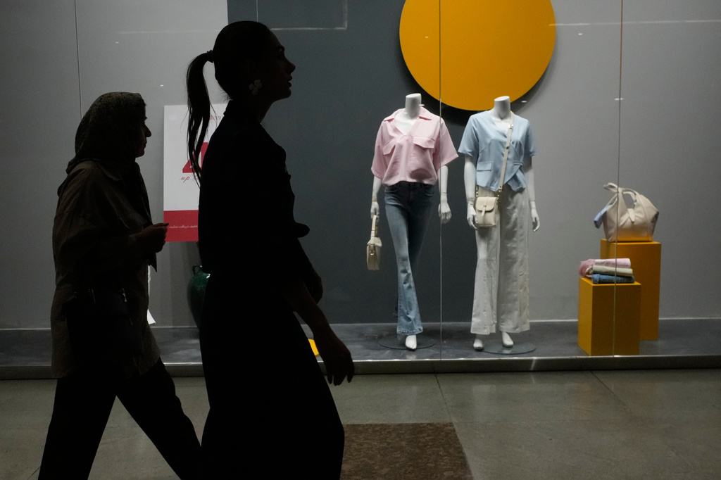 Women walk through the Iran Mall shopping center in Tehran, Iran, Thursday, July 30, 2026. (AP Photo/Vahid Salemi)