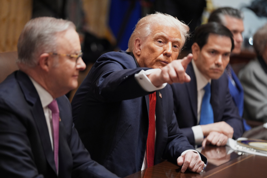 President Donald Trump, center, speaks during a meeting with Australian Prime Minister Anthony Albanese, left, as Secretary of State Marco Rubio listens in the Cabinet Room of the White House, Friday, October 20, 2025, in Washington. (AP Photo/Evan Vucci)