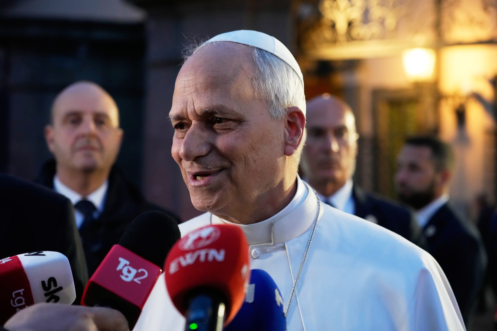 Pope Leo XIV talks to journalists as he leaves his residence in Castel Gandolfo, on the outskirts of Rome, to return to the Vatican, Tuesday, May 5, 2026. (AP Photo/Gregorio Borgia)
