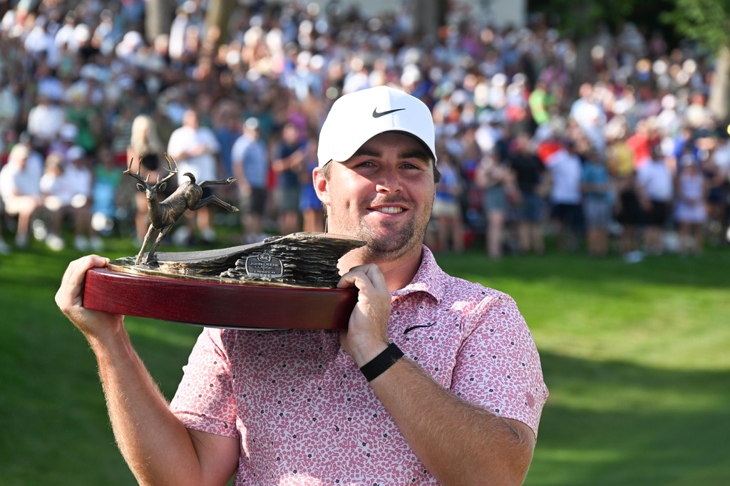 Chris Gotterup holds the trophy after winning the John Deere Classic golf tournament, Sunday, July 5, 2026, in Silvis, Ill. (AP Photo/Matt Marton)
