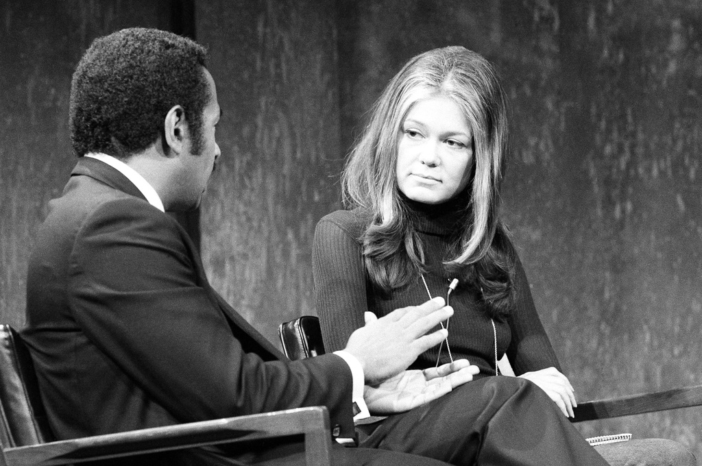 FILE - Gloria Steinem appears on ABC-TV's "Issues And Answers" program with Rep. John Conyers Jr., Dec. 26, 1971. (AP Photo/Jim Wells, File)