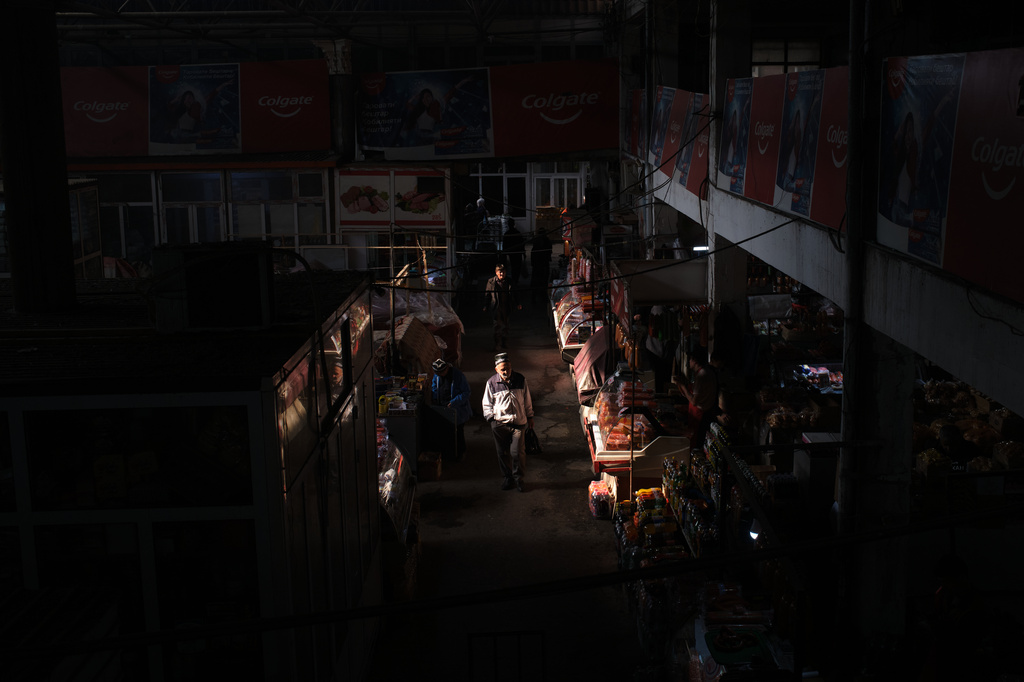 A man walks through a market in Istaravshan, Tajikistan, Monday, May 4, 2026. (AP Photo/Jon Orbach)