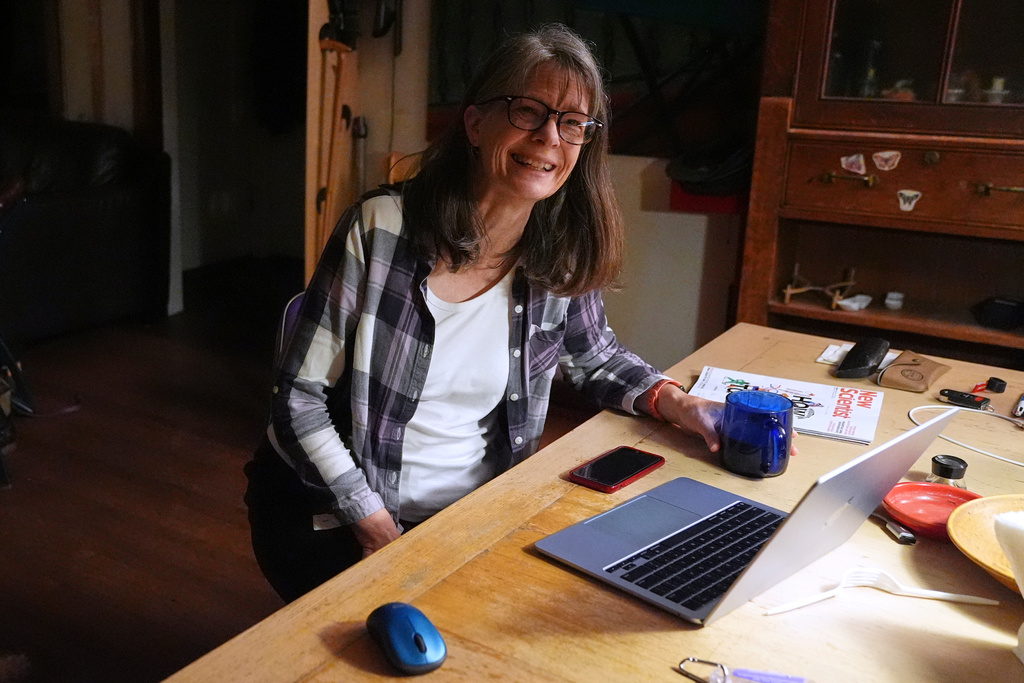 Mary E. Brunkow smiles after hearing about winning a Nobel Prize in medicine for part of her work on peripheral immune tolerance, in Seattle, Monday, Oct. 6, 2025. (AP Photo/Lindsey Wasson)