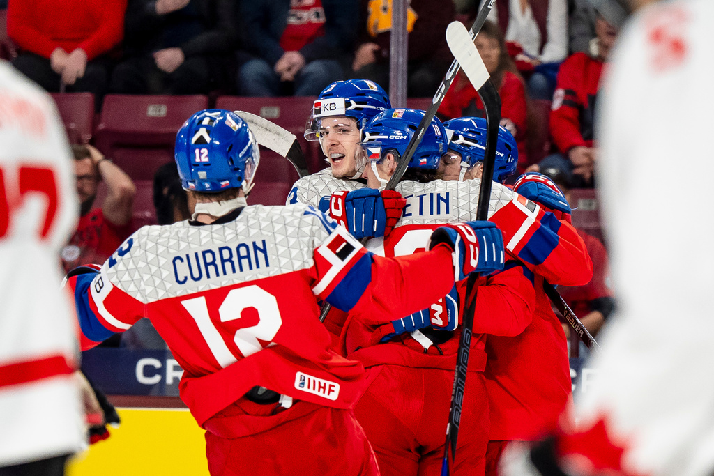 Czechia's Tomas Poletin (18), center, celebrates his goal with teammates during the first period of an IIHF World Junior Hockey Championship game against Canada in Minneapolis, Friday, Dec. 26, 2025. (Christopher Katsarov/The Canadian Press via AP)