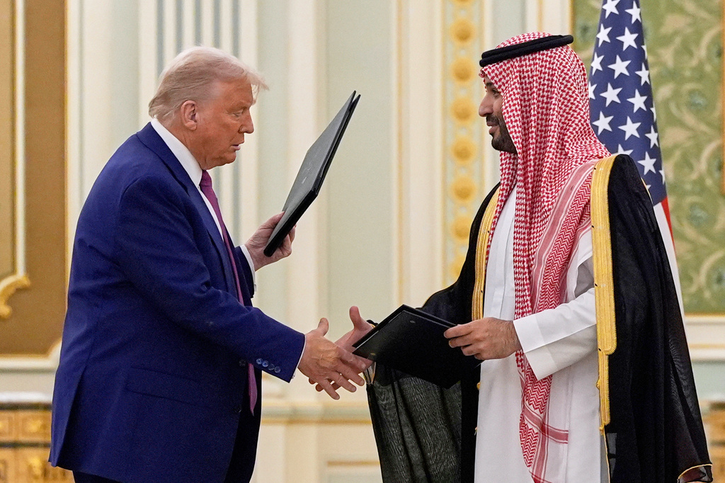 FILE - President Donald Trump and Saudi Crown Prince Mohammed bin Salman shake hands after exchanging documents during a signing ceremony at the Royal Palace in Riyadh, Saudi Arabia, May 13, 2025. (AP Photo/Alex Brandon, File)