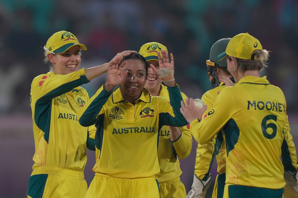 Australia's Alana King celebrates with teammates the wicket of Bangladesh's Shorna Akter during the ICC Women's Cricket World Cup match between Australia and Bangladesh at ACA–VDCA Cricket Stadium in Visakhapatnam, India, Thursday, Oct. 16, 2025. (AP Photo/Mahesh Kumar A.)