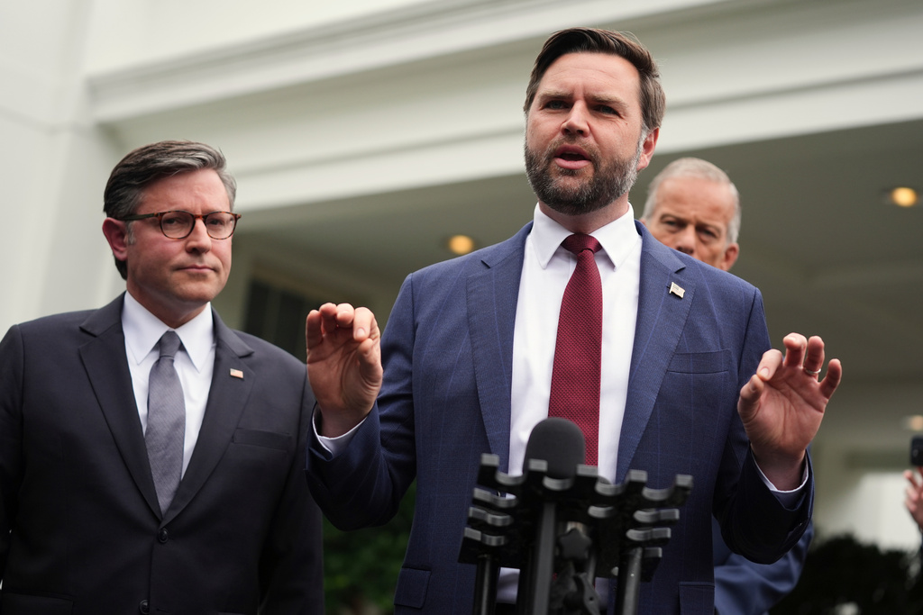 Vice President JD Vance, right, and House Speaker Mike Johnson, R-La., speak to members of the media outside the West Wing at the White House in Washington, Monday, Sept. 29, 2025, in Washington. (AP Photo/Evan Vucci)