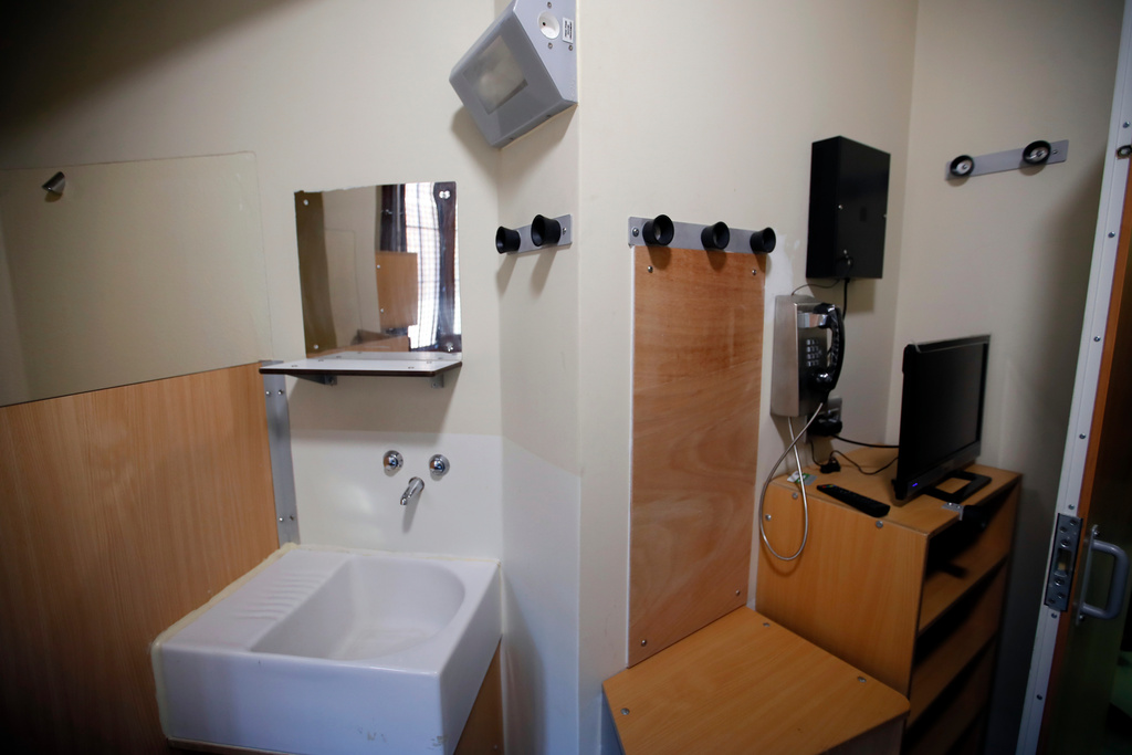 FILE - View of a cell in La Sante prison during a press visit after a four-year renovation project in Paris, Friday, April 12, 2019. (AP Photo/Francois Mori, File)