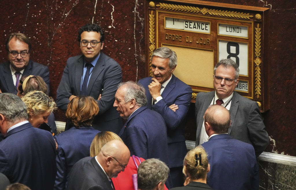 French Prime Minister Francois Bayrou leaves the National Assembly after losing a parliamentary confidence vote, Monday, Sept. 8, 2025 in Paris. (AP Photo/Christophe Ena)