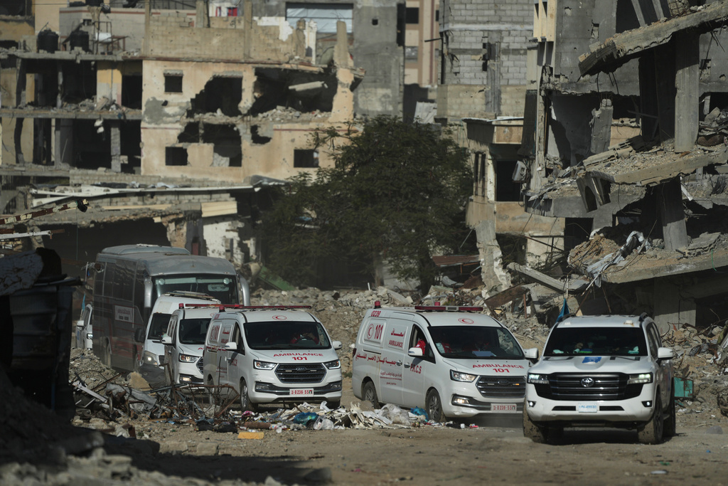 A U.N. vehicle escorts ambulances and a bus carrying Palestinian patients in Khan Younis as they travel to the Rafah crossing to leave the Gaza Strip for medical treatment abroad, Tuesday, Feb. 3, 2026. (AP Photo/Jehad Alshrafi)