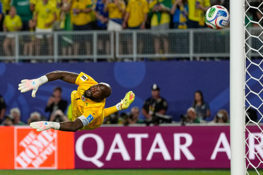 Haiti goalkeeper Johny Placide reaches for the ball during the World Cup Group C soccer match between Brazil and Haiti in Philadelphia, Friday, June 19, 2026. (AP Photo/Matt Slocum)