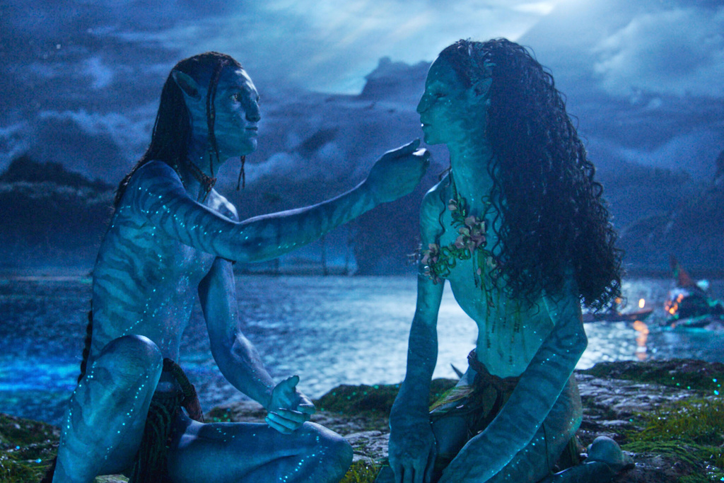 This image released by Disney shows Lo'ak, performed by Britain Dalton, left, and Tsireya, performed by Bailey Bass in a scene from "Avatar: Fire and Ash." (20th Century Studios/Disney via AP)