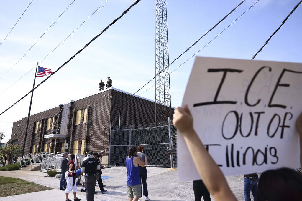 Immigration and Customs Enforcement facility officers stand guard outside an ICE facility in Broadview, Friday, Sept. 19, 2025. (Anthony Vazquez/Chicago Sun-Times via AP)