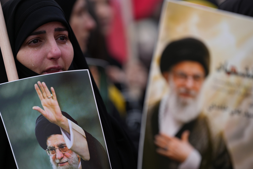 A woman cries as she mourns the death of Iranian Supreme Leader Ayatollah Ali Khamenei, during a gather in the southern Suburb of Beirut, Lebanon, Sunday, March 1, 2026. (AP Photo/Hassan Ammar)