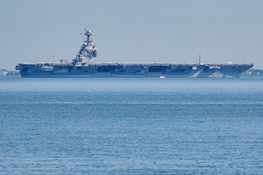 FILE - The USS Gerald R. Ford aircraft carrier leaves Naval Station Norfolk, June 23, 2025, in Norfolk, Va. (AP Photo/John Clark, File)