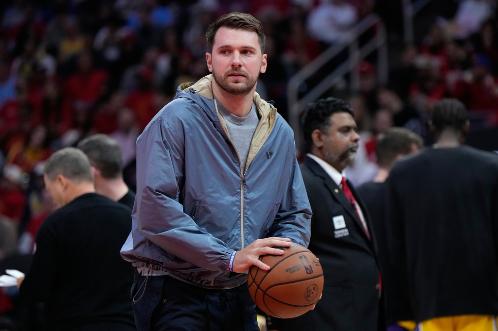 Los Angeles Lakers guard Luka Doncic holds a ball during a timeout in the first half of Game 6 of a first-round NBA playoffs basketball series against the Houston Rockets in Houston, Friday, May 1, 2026. (AP Photo/Ashley Landis)