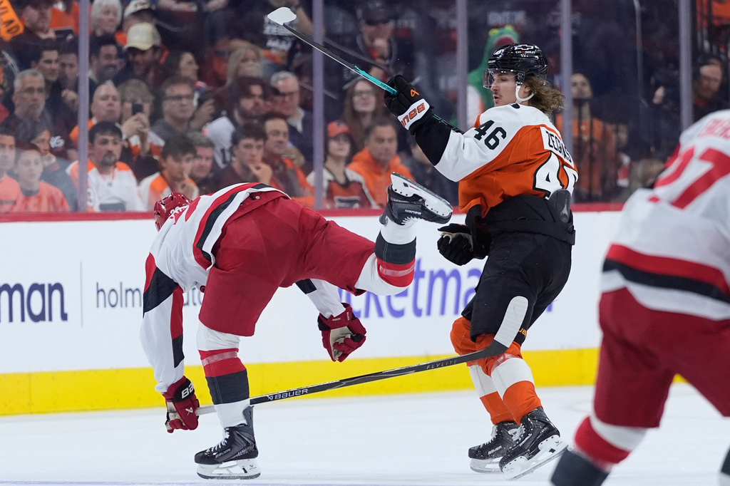 Carolina Hurricanes' Sean Walker, left, and Philadelphia Flyers' Trevor Zegras collide during the second period of Game 3 in the second round of the NHL hockey Stanley Cup playoffs, Thursday, May 7, 2026, in Philadelphia. (AP Photo/Matt Slocum)
