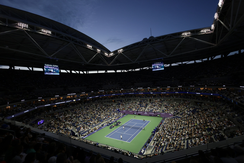 Venus Williams, and Serena Williams, of the United States, foreground, play against Hao-Ching Chan, of Taiwan, and Maya Joint, of Australia, during a women's doubles match at the U.S. Open tennis championships, Friday, Sept. 4, 2026, in New York. (AP Photo/Adam Hunger)