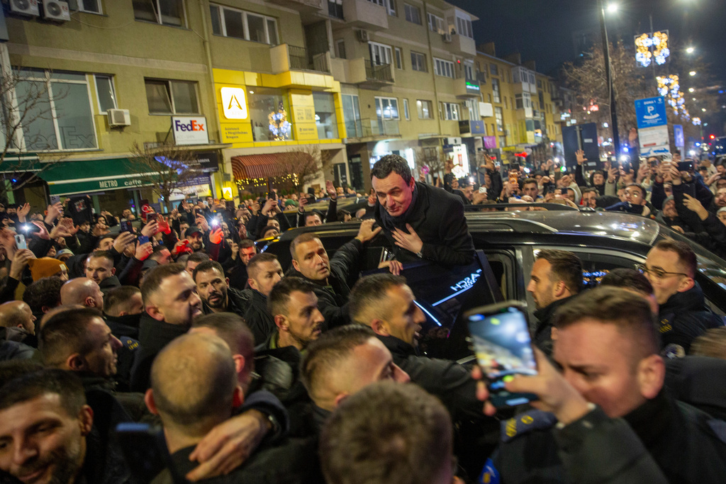 Kosovo's acting Prime Minister and leader of VeteVendosje political party Albin Kurti greets his supporters in Kosovo's capital Pristina, Sunday Dec. 28, 2025. (AP Photo/Visar Kryeziu)